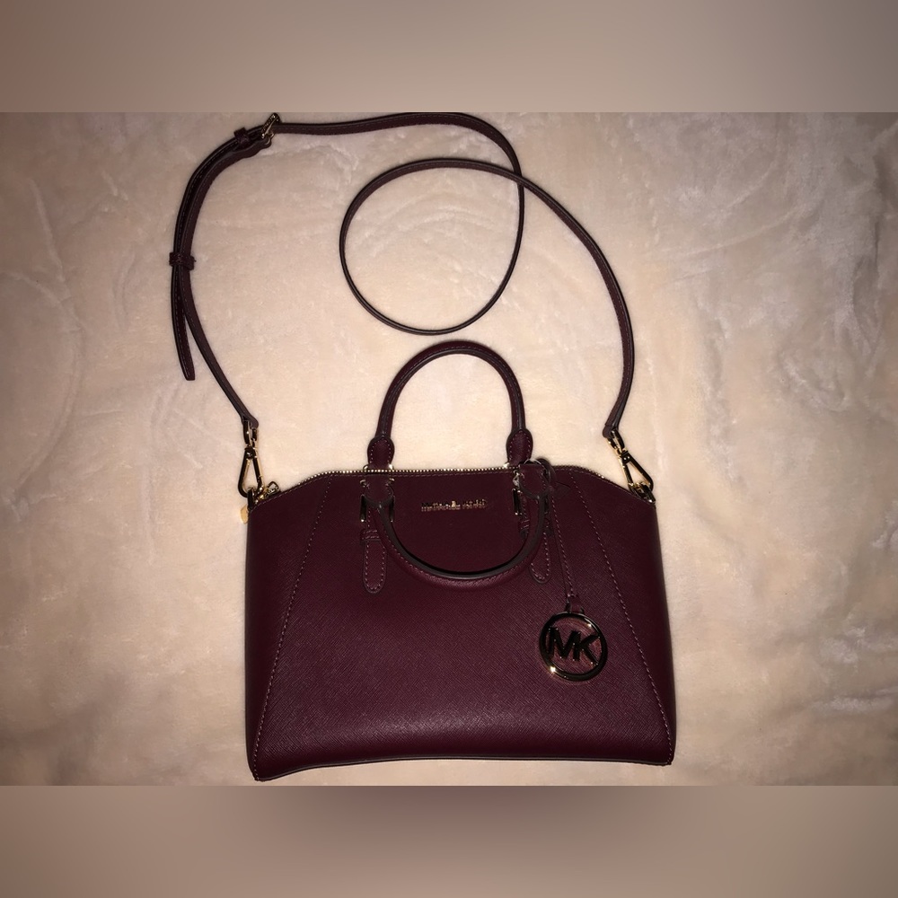 Brand new michael kors satchel in burgundy red never used no scuffs or stains